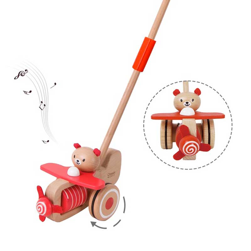 Wooden push-along musical toy - bear with a plane