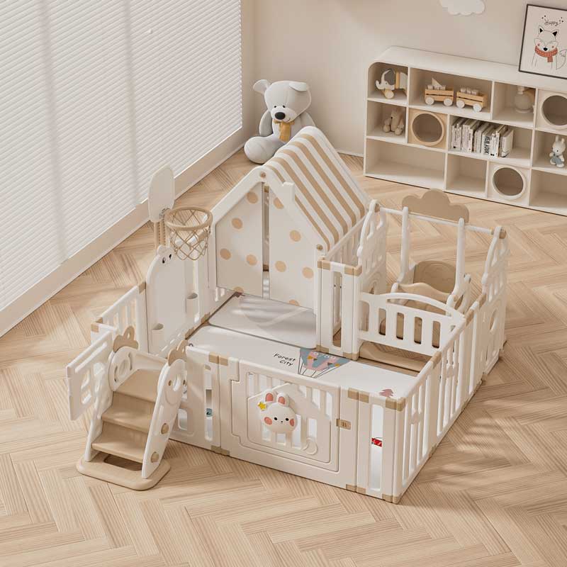 Children's indoor playground with a fence, swing, and active play elements